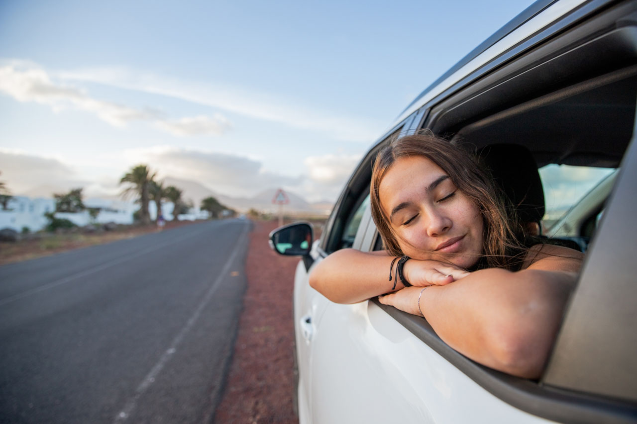 A,Teenage,Girl,Relaxes,While,In,The,Car,And,Sticks